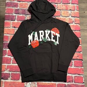 Market Black Clothing with Yellow Label